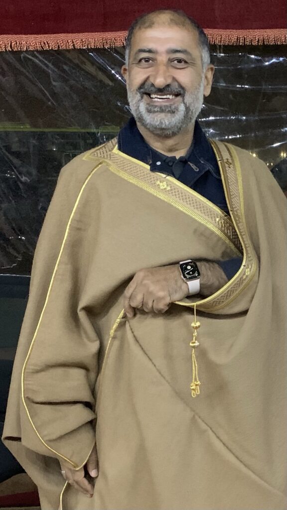 Author in Traditional Arab Abaya, gifted at the occasion of the conference