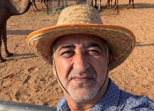 Dr. Abdul Raziq Kakar socializing with the dairy camels
